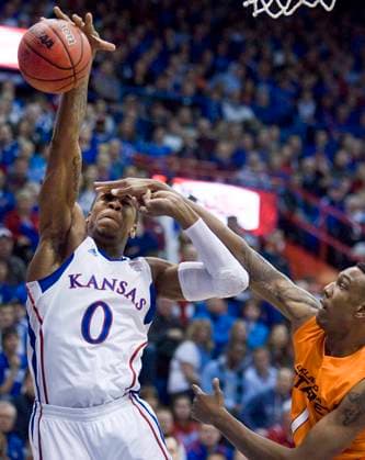 BKC-OKLAST-KANSAS Kansas s Thomas Robinson, left, battles Oklahoma State s Jarred Shaw for a rebound during the first half at Allen Fieldhouse in Lawrence, Kansas, Monday, February 21, 2011. Kansas Jayhawks won, 92-65. (Rich Sugg Kansas City Star MCT) Kansas City MO USA EDITORIAL USE ONLY Copyright: xx 1101433 RichxSuggx krtphotoslive470482