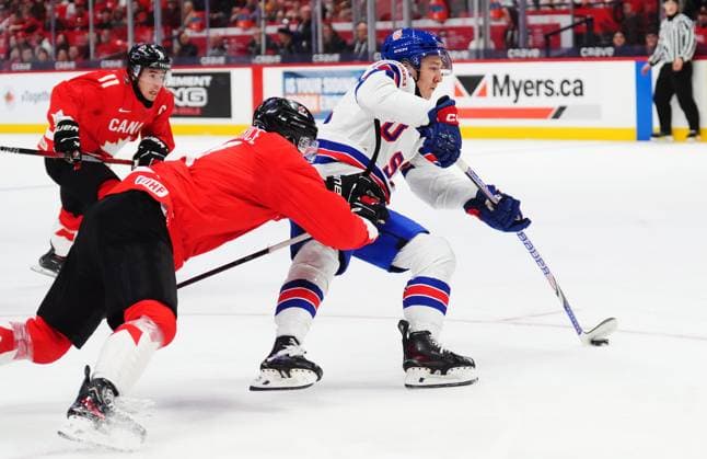 December 31, 2024, Ottawa, On, Canada: USA s Cole Hutson (right) shoots as Canada s Caden Price defends during first period IIHF World Junior Hockey Championship tournament action in Ottawa on Tuesday, Dec. 31, 2024. Canada News - December 31, 2024  - ZUMAc35_ 20241231_zaf_c35_006 Copyright: xSeanxKilpatrickx