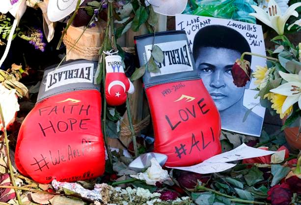 Muhammad Ali funeral Boxing gloves left at the makeshift memorial at the Muhammed Ali Center in downtown Louisville, Ky., on Friday, June 10, 2016. Ali, a three-time world heavyweight champion, died June 3, 2016, at 74. (Charles Bertram Lexington Herald-Leader TNS) Louisville KY USA EDITORIAL USE ONLY Copyright: xx 1185989 CharlesxBertramx krtphotoslive755270