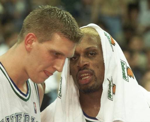 BASKETBALL PRO ATHLETE Dennis Rodman talks with Dirk Nowitzki during a timeout in the second quarter. Wednesday night was Rodman s first game in a Dallas Maverick uniform with the Mavericks playing the Seattle Supersonics. (RON J. JENKINS FORT WORTH STAR-TELEGRAM TNS) DALLAS TX USA EDITORIAL USE ONLY Copyright: xx 1211749 RONxJ.xJENKINSx krtphotoslive802127