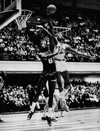 Bob Ford: Wilt Chamberlain and the science of Ã¢â‚¬Ëœload managementÃ¢â‚¬â ¢ The Philadelphia 76ers Wilt Chamberlain does a finger roll over the outstretched arms of nemesis Bill Russell of the Boston Celtics at The Convention Center in Philadelphia. (Philadelphia Inquirer TNS) PHILADELPHIA PA USA EDITORIAL USE ONLY Copyright: xx 1215490 PhiladelphiaxInquirerx krtphotoslive808215