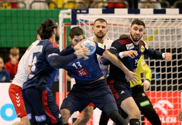 Photo Nikola Karabatic France and right Ludovic Fabregas France against Lukas Meister middle European Handball Championship, preliminary round in Berlin , on Sun 14 01 2024 Switzerland France 26 26