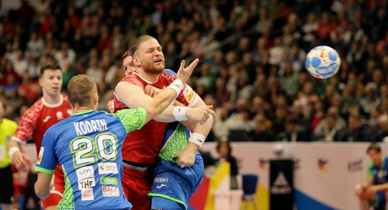 Photo goal scored by Maciej GEBALA Poland , against Tilen KODRIN Slovenia , left European Handball Championship, preliminary round in Berlin , Poland Slovenia on Sat 13 01 2024