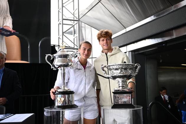 TENNIS AUSTRALIAN OPEN DRAW, Aryna Sabalenka of Belarus (left) poses for a photo with the Daphne Akhurst Memorial Cup and Jannik Sinner of Italy (right) poses for photographs with the Norman Brookes Challenge Cup pose for a photo during the draw for the 2025 Australian Open tennis tournament, at Melbourne Park, Melbourne, Thursday, January 09, 2025. ( NO ARCHIVING, EDITORIAL USE ONLY, NO USE IN BOOKS WITHOUT CONSENT Melbourne Victoria Australia  Copyright: xJOELxCARRETTx 20250109137103392930
