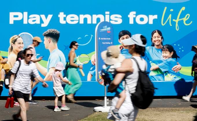 (250111) -- MELBOURNE, Jan. 11, 2025 -- People walk past the poster wall at Melbourne Park in Melbourne, Australia, Jan. 11, 2025. The main draw of the 2025 Australian Open runs from Jan. 12 to 26. ) (SP)AUSTRALIA-MELBOURNE-AUSTRALIAN OPEN MaxPing 