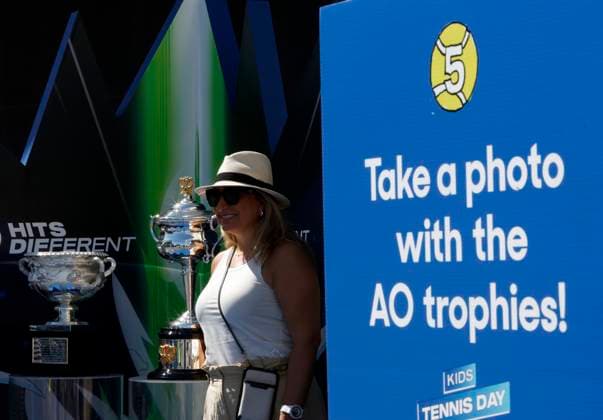(250111) -- MELBOURNE, Jan. 11, 2025 -- A woman poses for photos with the trophies at Melbourne Park in Melbourne, Australia, Jan. 11, 2025. The main draw of the 2025 Australian Open runs from Jan. 12 to 26. ) (SP)AUSTRALIA-MELBOURNE-AUSTRALIAN OPEN MaxPing 