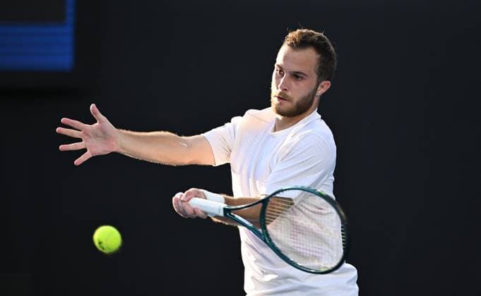 TENNIS AUSTRALIAN OPEN, Hugo Gaston of France returns during his round 1 match against Omar Jasika of Australia during the 2025 Australian Open at Melbourne Park in Melbourne, Sunday, January 12, 2025. ( NO ARCHIVING, EDITORIAL USE ONLY, NO USE IN BOOKS WITHOUT CONSENT MELBOURNE VICTORIA AUSTRALIA  Copyright: xJAMESxROSSx 20250112172991009167