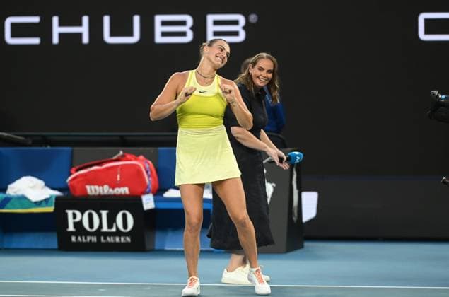 TENNIS AUSTRALIAN OPEN, Aryna Sabalenka of Belarus and television commentator Jelena Dokic dance following Sabalenkas round 1 match win against Sloane Stephens of USA during the 2025 Australian Open at Melbourne Park in Melbourne, Sunday, January 12, 2025. ( NO ARCHIVING, EDITORIAL USE ONLY, NO USE IN BOOKS WITHOUT CONSENT MELBOURNE VICTORIA AUSTRALIA  Copyright: xLUKASxCOCHx 20250112163078374163