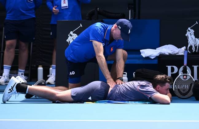TENNIS AUSTRALIAN OPEN, Dominic Stricker of Switzerland receives medical attention during his round 1 match against James Duckworth of Australia during the 2025 Australian Open at Melbourne Park in Melbourne, Monday, January 13, 2025. ( NO ARCHIVING, EDITORIAL USE ONLY, NO USE IN BOOKS WITHOUT CONSENT MELBOURNE VICTORIA AUSTRALIA  Copyright: xJOELxCARRETTx 20250113155357565405