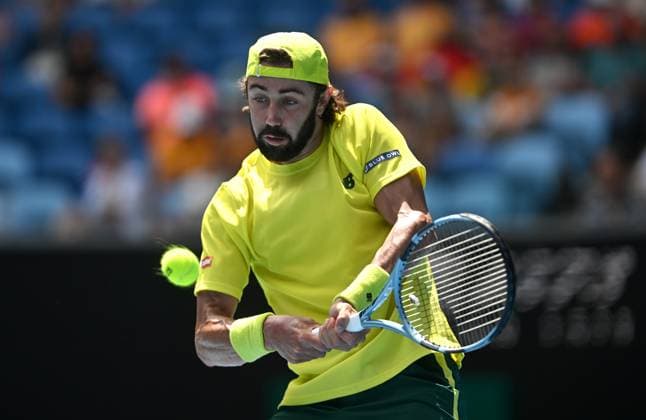 TENNIS AUSTRALIAN OPEN, Jordan Thompson of Australia returns during his round 1 match against Dominik Koepfer of Germany during the 2025 Australian Open at Melbourne Park in Melbourne, Monday, January 13, 2025. ( NO ARCHIVING, EDITORIAL USE ONLY, NO USE IN BOOKS WITHOUT CONSENT MELBOURNE VICTORIA AUSTRALIA  Copyright: xLUKASxCOCHx 20250113150280823142