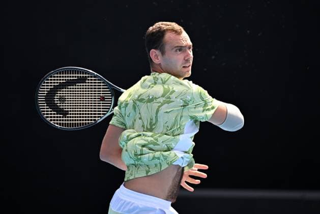 TENNIS AUSTRALIAN OPEN, Roman Safiullin of Russia in action during his round 1 match against Thanasi Kokkinakis of Australia during the 2025 Australian Open at Melbourne Park in Melbourne, Monday, January 13, 2025. ( NO ARCHIVING, EDITORIAL USE ONLY, NO USE IN BOOKS WITHOUT CONSENT MELBOURNE VICTORIA AUSTRALIA  Copyright: xJAMESxROSSx 20250113196265137355