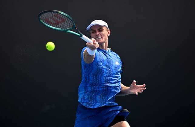TENNIS AUSTRALIAN OPEN, Tristian Schoolkate of Australia returns during his round 1 match against Taro Daniel of Japan during the 2025 Australian Open at Melbourne Park in Melbourne, Monday, January 13, 2025. ( NO ARCHIVING, EDITORIAL USE ONLY, NO USE IN BOOKS WITHOUT CONSENT MELBOURNE VICTORIA AUSTRALIA  Copyright: xLUKASxCOCHx 20250113165117403658