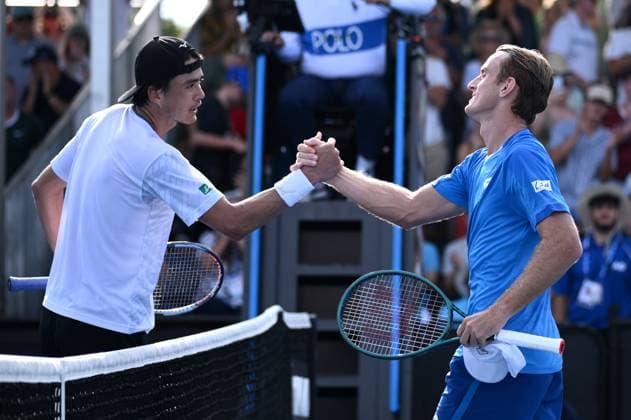 TENNIS AUSTRALIAN OPEN, Taro Daniel of Japan (left) shakes hands with Tristian Schoolkate of Australia following their round 1 match during the 2025 Australian Open at Melbourne Park in Melbourne, Monday, January 13, 2025. ( NO ARCHIVING, EDITORIAL USE ONLY, NO USE IN BOOKS WITHOUT CONSENT MELBOURNE VICTORIA AUSTRALIA  Copyright: xJOELxCARRETTx 20250113127240236974