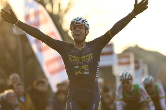 Belgian Toon Aerts celebrates as he crosses the finish line at the men s elite race of the Cyclocross Otegem cycling event, in Otegem, the day after the Belgian national cyclocross championships. DAVIDxPINTENS  x110334906x