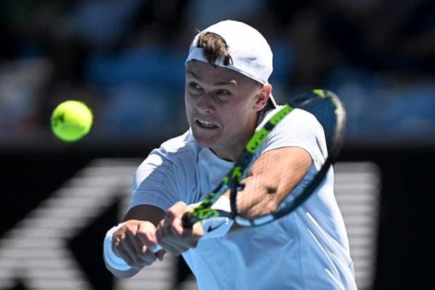TENNIS AUSTRALIAN OPEN, Holger Rune of Denmark returns during his round 1 match against Zhang Zhizhen of China during the 2025 Australian Open at Melbourne Park in Melbourne, Tuesday, January 14, 2025. ( NO ARCHIVING, EDITORIAL USE ONLY, NO USE IN BOOKS WITHOUT CONSENT MELBOURNE VICTORIA AUSTRALIA  Copyright: xLUKASxCOCHx 20250114110704472169