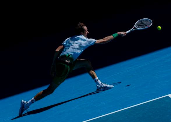 (250114) -- MELBOURNE, Jan. 14, 2025 -- Daniil Medvedev hits a return during the men s singles first round match between Daniil Medvedev of Russia and Kasidit Samrej of Thailand at Australian Open tennis tournament in Melbourne, Australia, Jan. 14, 2025. (Photo by Xinhua) (SP)AUSTRALIA-MELBOURNE-TENNIS-AUSTRALIAN OPEN-DAY 3 ChuxChen 