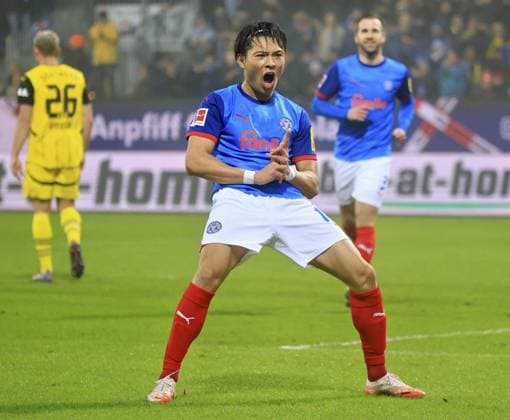 Soccer: German Bundesliga Holstein Kiel s Shuto Machino celebrates after scoring in the first half of a German Bundesliga football match against Borussia Dortmund on Jan. 14, 2025, in Kiel, Germany.  A14AA0003983148P