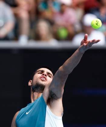 (250115) -- MELBOURNE, Jan. 15, 2025 -- Carlos Alcaraz serves during the men s singles 2nd round match between Carlos Alcaraz of Spain and Nishioka Yoshihito of Japan at Australian Open tennis tournament in Melbourne, Australia, Jan. 15, 2025. ) (SP)AUSTRALIA-MELBOURNE-TENNIS-AUSTRALIAN OPEN-DAY 4 MaxPing 