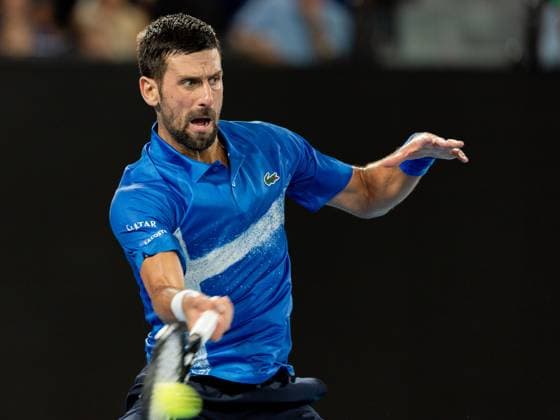 (250115) -- MELBOURNE, Jan. 15, 2025 -- Novak Djokovic hits a return during the men s singles second round match between Novak Djokovic of Serbia and Jaime Faria of Portugal at Australian Open tennis tournament in Melbourne, Australia, Jan. 15, 2025. (Photo by Xinhua) (SP)AUSTRALIA-MELBOURNE-TENNIS-AUSTRALIAN OPEN HuxJingchen 