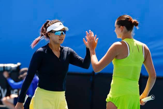 (250116) -- MELBOURNE, Jan. 16, 2025 -- Guo Hanyu (L) Alexandra Panova celebrate scoring during the women s doubles first round match between Guo Hanyu (China) Alexandra Panova (Russia) and Australia s Lizette Cabrera Taylah Preston at Australian Open tennis tournament in Melbourne, Australia, Jan. 16, 2025. (Photo by Xinhua) (SP)AUSTRALIA-MELBOURNE-TENNIS-AUSTRALIAN OPEN ChuxChen 