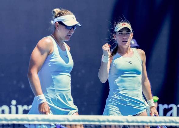 (250117) -- MELBOURNE,, Jan. 17, 2025 -- Timea Babos (R) Nicole Melichar-Martinez react during the women s doubles second round match between Yuan Yue (China) Ekaterina Alexandrova (Russia) and Timea Babos (Hungary) Nicole Melichar-Martinez (the United States) at Australian Open tennis tournament in Melbourne, Australia, Jan. 17, 2025. (Photo by Xinhua) (SP)AUSTRALIA-MELBOURNE-TENNIS-AUSTRALIAN OPEN-DAY 6 ChuxChen 