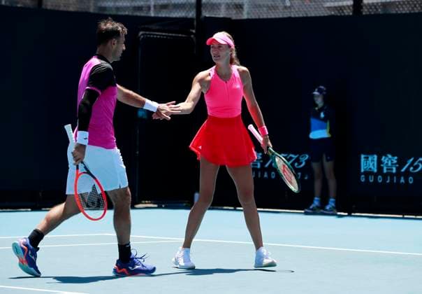 (250117) -- MELBOURNE, Jan. 17, 2025 -- Kristina Mladenovic (R) Ivan Dodig celebrate scoring during the mixed doubles 1st round match between Zhang Shuai (China) Rohan Bopanna (India) and Kristina Mladenovic (France) Ivan Dodig (Croatia) at Australian Open tennis tournament in Melbourne, Australia, Jan. 17, 2025. ) (SP)AUSTRALIA-MELBOURNE-TENNIS-AUSTRALIAN OPEN-DAY 6 MaxPing 