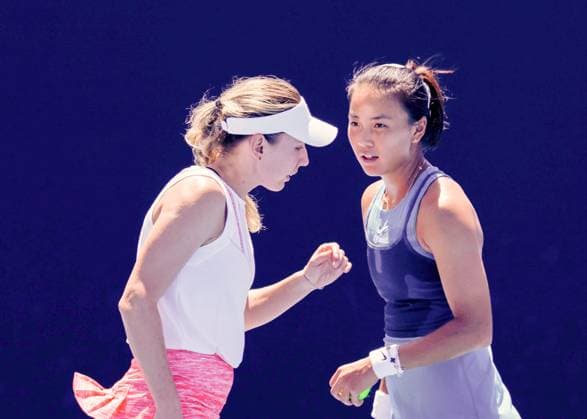 (250117) -- MELBOURNE,, Jan. 17, 2025 -- Yuan Yue (R) Ekaterina Alexandrova react during the women s doubles second round match between Yuan Yue (China) Ekaterina Alexandrova (Russia) and Timea Babos (Hungary) Nicole Melichar-Martinez (the United States) at Australian Open tennis tournament in Melbourne, Australia, Jan. 17, 2025. (Photo by Xinhua) (SP)AUSTRALIA-MELBOURNE-TENNIS-AUSTRALIAN OPEN-DAY 6 ChuxChen 