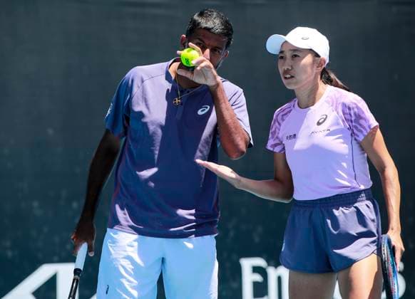 (250117) -- MELBOURNE, Jan. 17, 2025 -- Zhang Shuai (R) talks with Rohan Bopanna during the mixed doubles 1st round match between Zhang Shuai (China) Rohan Bopanna (India) and Kristina Mladenovic (France) Ivan Dodig (Croatia) at Australian Open tennis tournament in Melbourne, Australia, Jan. 17, 2025. ) (SP)AUSTRALIA-MELBOURNE-TENNIS-AUSTRALIAN OPEN-DAY 6 MaxPing 