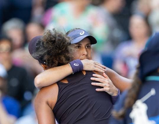 (250117) -- MELBOURNE, Jan. 17, 2025 -- Belinda Bencic(R) hugs Osaka Naomi after the women s singles 3rd round match between Osaka Naomi of Japan and Belinda Bencic of Switzerland at Australian Open tennis tournament in Melbourne, Australia, Jan. 17, 2025. (Photo by Xinhua) (SP)AUSTRALIA-MELBOURNE-TENNIS-AUSTRALIAN OPEN-DAY 6 HuxJingchen 