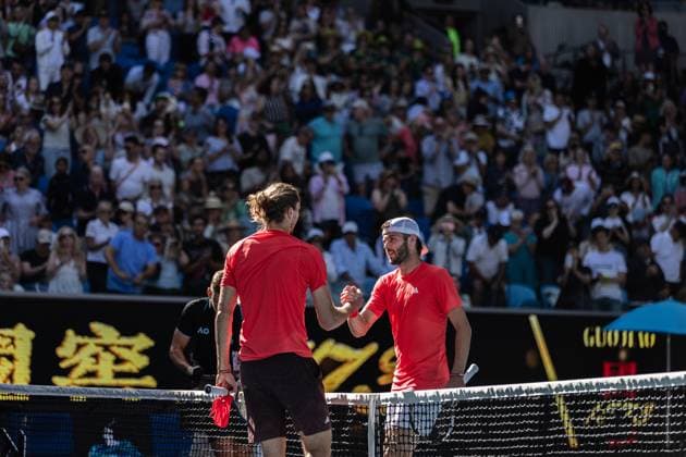 (250117) -- MELBOURNE, Jan. 17, 2025 -- Jacob Fearnley (R) of Britain greets Alexander Zverev of Germany after the men s singles 3rd round match at Australian Open tennis tournament in Melbourne, Australia, Jan. 17, 2025. (Photo by Xinhua) (SP)AUSTRALIA-MELBOURNE-TENNIS-AUSTRALIAN OPEN-DAY 6 HuxJingchen 
