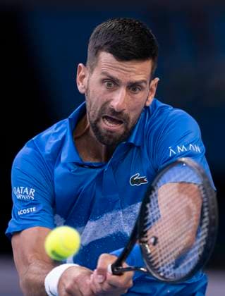 (250117) -- MELBOURNE, Jan. 17, 2025 -- Novak Djokovic hits a return during the men s singles 3rd round match between Novak Djokovic of Serbia and Tomas Machac of the Czech Republic at Australian Open tennis tournament in Melbourne, Australia, Jan. 17, 2025. ) (SP)AUSTRALIA-MELBOURNE-TENNIS-AUSTRALIAN OPEN-DAY 6 LuixSiuxWai 
