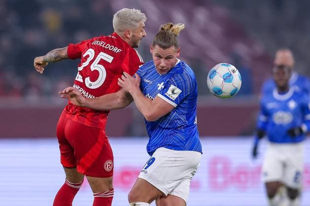 17 01 2025, Football, Fortuna Düsseldorf SV Darmstadt 98, 2 Fußball Bundesliga, 18 Matchday, Merkur Spiel Arena, Saison 2024 2025 Matthias Zimmermann Fortuna Düsseldorf 25 in duel against Fynn Lakenmacher SV Darmstadt 19 DFB regulations prohibit any use of photographs as image sequences and or quasi video Nordrhein Westfalen Germany