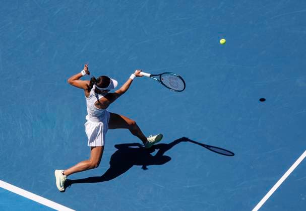 (250118) -- MELBOURNE, Jan. 18, 2025 -- Emma Raducanu hits a return during the women s singles 3rd round match between Iga Swiatek of Poland and Emma Raducanu of Britain at Australian Open tennis tournament in Melbourne, Australia, Jan. 18, 2025. ) (SP)AUSTRALIA-MELBOURNE-TENNIS-AUSTRALIAN OPEN-DAY 7 MaxPing 