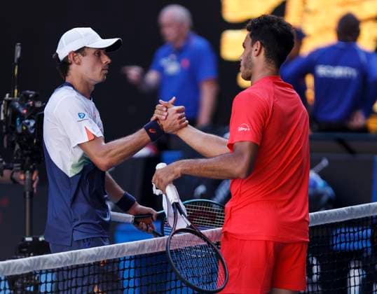 (250118) -- MELBOURNE, Jan. 18, 2025 -- Alex de Minaur (L) greets Francisco Cerundolo after the men s singles 3rd round match between Alex de Minaur of Australia and Francisco Cerundolo of Argentina at Australian Open tennis tournament in Melbourne, Australia, Jan. 18, 2025. ) (SP)AUSTRALIA-MELBOURNE-TENNIS-AUSTRALIAN OPEN-DAY 7 MaxPing 