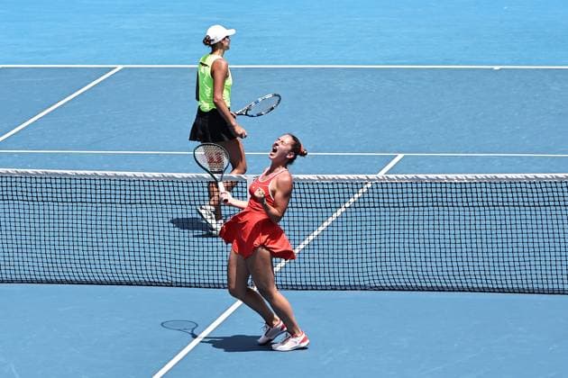 Marta Kostyuk blonde hair , UKR, and Elena Gabriela Ruse red cap , ROU, during womenÂs doubles at 2025 Australian Open in Melbourne, 19 01 2025