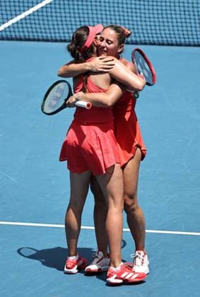 Marta Kostyuk blonde hair , UKR, and Elena Gabriela Ruse red cap , ROU, during womenÂs doubles at 2025 Australian Open in Melbourne, 19 01 2025