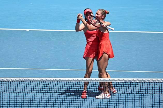 Marta Kostyuk blonde hair , UKR, and Elena Gabriela Ruse red cap , ROU, during womenÂs doubles at 2025 Australian Open in Melbourne, 19 01 2025