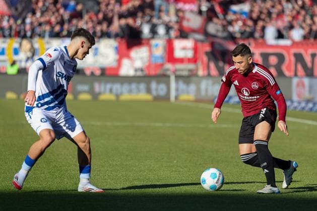 in duel, action, with Rafael Pinto Pedrosa 36 Karlsruher SC , Danilo Soares 3 1 FC Nuernberg , 1 FC Nuernberg vs Karlsruher SC, Soccer, 2 Bundesliga, 18 Matchday, 19 01 2025 DFB regulations prohibit any use of photographs as image sequences and or quasi video Nuernberg Bayern Germany Copyright: xkolbert-press MartinxAgüerax