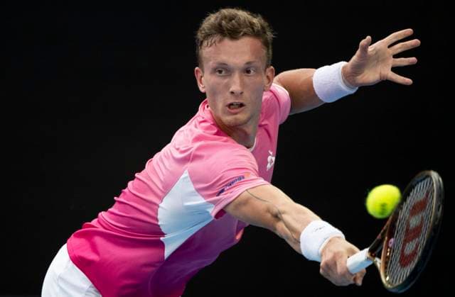 (250119) -- MELBOURNE, Jan. 19, 2025 -- Jiri Lehecka hits a return during the men s singles 4th round match between Novak Djokovic of Serbia and Jiri Lehecka of the Czech Republic at Australian Open tennis tournament in Melbourne, Australia, Jan. 19, 2025. ) (SP)AUSTRALIA-MELBOURNE-TENNIS-AUSTRALIAN OPEN-DAY 8 LuixSiuxWai 