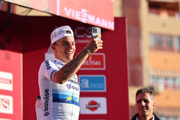 Winner Belgian Thibau Nys using his smartphone on the podium after winning the men s elite race at the cyclocross cycling event in Benidorm, Spain, Sunday 19 January 2025, stage 12 14 in the UCI World Cup competition. DAVIDxPINTENS  x110725600x