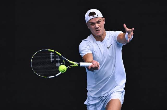 TENNIS AUSTRALIAN OPEN, Holger Rune of Denmark returns during his round 4 match against Jannik Sinner of Italy during the 2025 Australian Open at Melbourne Park in Melbourne, Monday, January 20, 2025. ( NO ARCHIVING, EDITORIAL USE ONLY, NO USE IN BOOKS WITHOUT CONSENT MELBOURNE VICTORIA AUSTRALIA  Copyright: xJAMESxROSSx 20250120137781951835