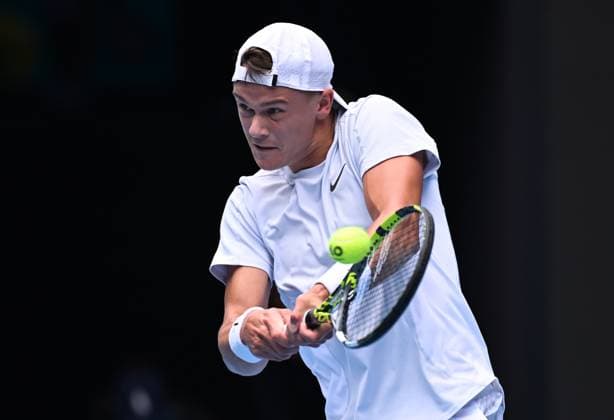 TENNIS AUSTRALIAN OPEN, Holger Rune of Denmark returns during his round 4 match against Jannik Sinner of Italy during the 2025 Australian Open at Melbourne Park in Melbourne, Monday, January 20, 2025. ( NO ARCHIVING, EDITORIAL USE ONLY, NO USE IN BOOKS WITHOUT CONSENT MELBOURNE VICTORIA AUSTRALIA  Copyright: xJAMESxROSSx 20250120122749027400