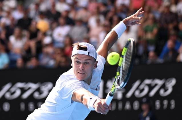 TENNIS AUSTRALIAN OPEN, Holger Rune of Denmark returns during his round 4 match against Jannik Sinner of Italy during the 2025 Australian Open at Melbourne Park in Melbourne, Monday, January 20, 2025. ( NO ARCHIVING, EDITORIAL USE ONLY, NO USE IN BOOKS WITHOUT CONSENT MELBOURNE VICTORIA AUSTRALIA  Copyright: xJAMESxROSSx 20250120197492191168