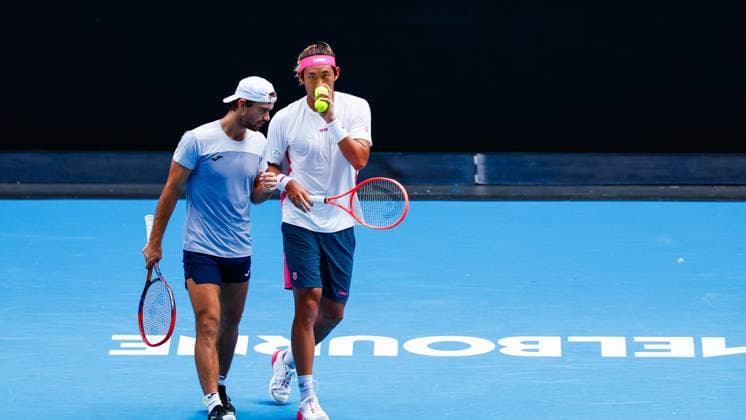 (250120) -- MELBOURNE, Jan. 20, 2025 -- Zhang Zhizhen (R) Tomas Machac react during the men s doubles third round match between Zhang Zhizhen (China) Tomas Machac (the Czech Republic) and Hugo Nys (Monaco) Edouard Roger-Vasselin (France) at Australian Open tennis tournament in Melbourne, Australia, Jan. 20, 2025. (Photo by Xinhua) (SP)AUSTRALIA-MELBOURNE-TENNIS-AUSTRALIAN OPEN-DAY 9 ChuxChen 