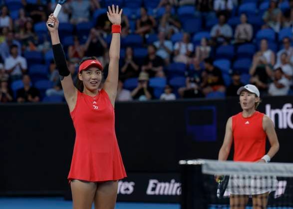 (250120) -- MELBOURNE, Jan. 20, 2025 -- Wang Xinyu (L) Zheng Saisai celebrate scoring during the women s doubles third round match between Wang Xinyu Zheng Saisai of China and Kamilla Rakhimova (Russia) Sara Sorribes Tormo (Spain) at Australian Open tennis tournament in Melbourne, Australia, Jan. 20, 2025. (Photo by Xinhua) (SP)AUSTRALIA-MELBOURNE-TENNIS-AUSTRALIAN OPEN-DAY 9 ChuxChen 
