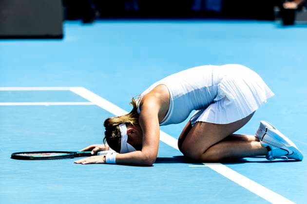 MELBOURNE, VIC - JANUARY 21: Paula Badosa of Spain falls to the ground after winning her match in the Quarterfinals of the 2025 Australian Open on January 21 2025, at Melbourne Park in Melbourne, Australia. (Photo by Jason Heidrich Icon Sportswire) TENNIS: JAN 21 Australian Open EDITORIAL USE ONLY Icon250121002