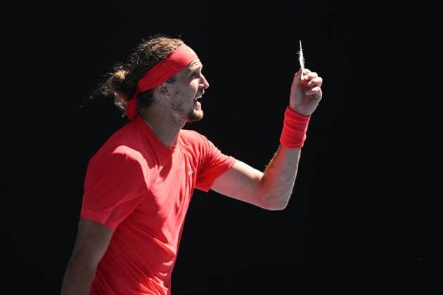 TENNIS AUSTRALIAN OPEN, Alexander Zverev of Germany reacts as he holds a feather during his 1 4 final match against Tommy Paul of USA during the 2025 Australian Open at Melbourne Park in Melbourne, Tuesday, January 21, 2025. ( NO ARCHIVING, EDITORIAL USE ONLY, NO USE IN BOOKS WITHOUT CONSENT MELBOURNE VICTORIA AUSTRALIA  Copyright: xLUKASxCOCHx 20250121130694129136