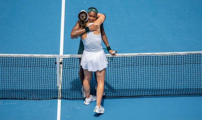 (250121) -- MELBOURNE, Jan. 21, 2025 -- Coco Gauff (Rear) hugs Paula Badosa after the women s singles quarterfinals match between Coco Gauff of the United States and Paula Badosa of Spain at the Australian Open tennis tournament in Melbourne, Australia, Jan. 21, 2025. (Photo by Xinhua) (SP)AUSTRALIA-MELBOURNE-TENNIS-AUSTRALIAN OPEN-DAY 10 HuxJingchen 