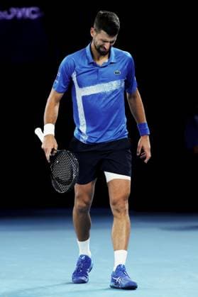 Novak Djokovic winces with his leg bandaged after a medical timeout during his Quarter-final match against Alcaraz in the Rod Laver Arena Australian Open, Day Ten, Tennis, Melbourne Park, Melbourne, Australia - 21 Jan 2025  Copyright: xEllaxLing Shutterstockx 15108779bh