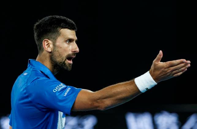 (250121) -- MELBOURNE, Jan. 21, 2025 -- Novak Djokovic reacts during the men s singles quarterfinal between Novak Djokovic of Serbia and Carlos Alcaraz of Spain at Australian Open tennis tournament in Melbourne, Australia, Jan. 21, 2025. ) (SP)AUSTRALIA-MELBOURNE-TENNIS-AUSTRALIAN OPEN-DAY 10 MaxPing 